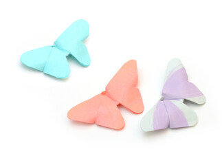 Flying colorful paper butterflies isolated white