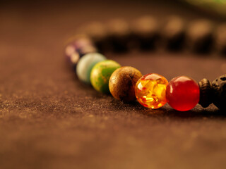 Chakra aromatherapy bracelet lava stone, selective focus, macro