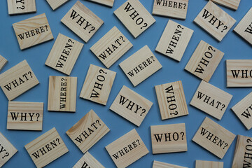 Text on wooden tile block on blue background