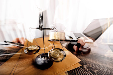 justice and law concept.Male judge in a courtroom on wooden table and Counselor or Male lawyer working in office. Legal law, advice and justice concept.