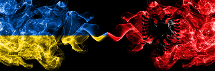 Fototapeta premium Ukraine, Ukrainian vs Albania, Albanian smoky mystic flags placed side by side. Thick colored silky abstract smokes flags.