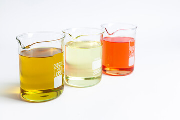 cosmetic natural oils in chemical glass jars