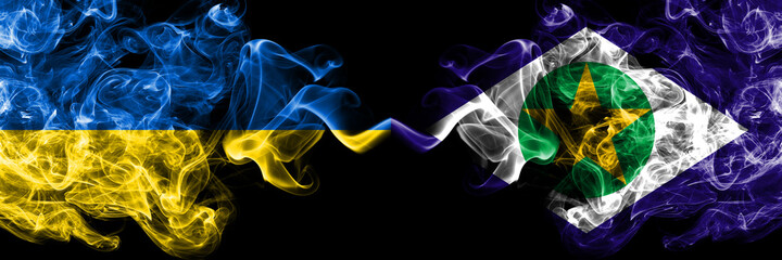Ukraine, Ukrainian vs Brazil, Brazilian, Mato Grosso smoky mystic flags placed side by side. Thick colored silky abstract smokes flags.