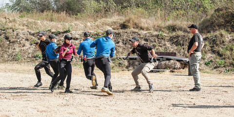 Group of students on training for handling and shooting in shooting range