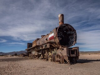 Old historic abandoned train engine locomotive ruins at Cementerio de Trenes cemetery graveyard, Salar de Uyuni Bolivia