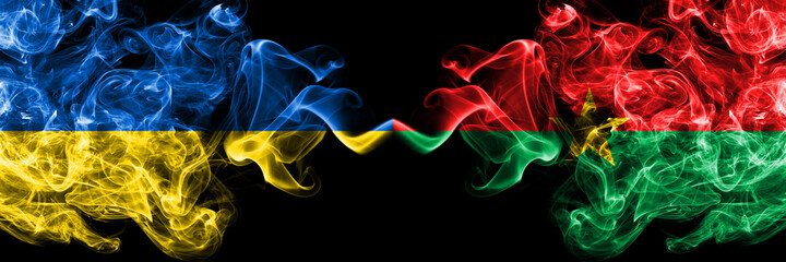 Ukraine, Ukrainian vs Burkina Faso, Burkinese smoky mystic flags placed side by side. Thick colored silky abstract smokes flags.