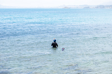 woman snorkeling with her dog