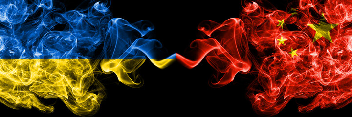 Ukraine, Ukrainian vs China, Chinese smoky mystic flags placed side by side. Thick colored silky abstract smokes flags.