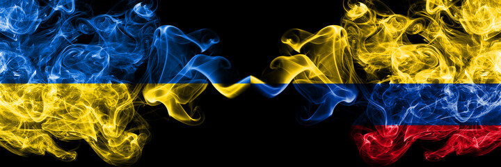 Ukraine, Ukrainian vs Colombia, Colombian smoky mystic flags placed side by side. Thick colored silky abstract smokes flags.