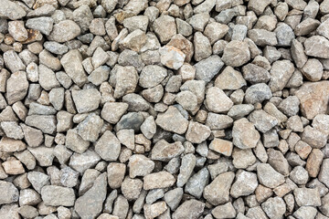 A road made of coarse gravel for trucks. Close-up of the gravel texture.