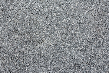 Natural fine crushed stone of gray color. Top view.
