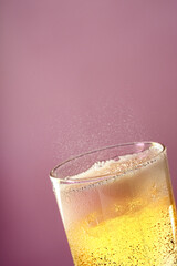 Fruit sparkling water is poured into a glass.