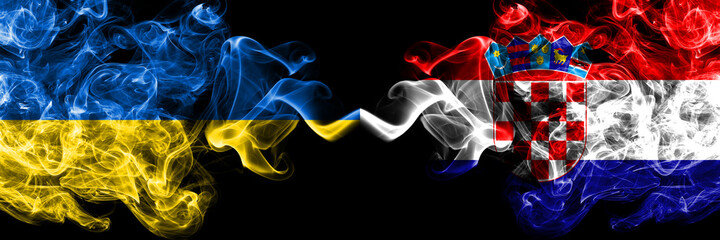 Ukraine, Ukrainian vs Croatia, Croatian smoky mystic flags placed side by side. Thick colored silky abstract smokes flags.