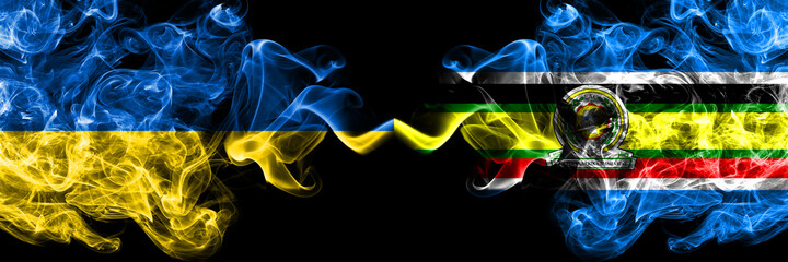 Ukraine, Ukrainian vs East African Community smoky mystic flags placed side by side. Thick colored silky abstract smokes flags.