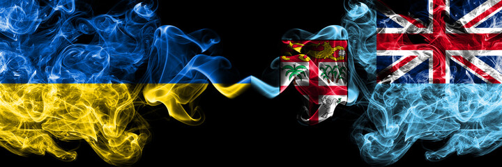 Ukraine, Ukrainian vs Fiji, Fijian smoky mystic flags placed side by side. Thick colored silky abstract smokes flags.