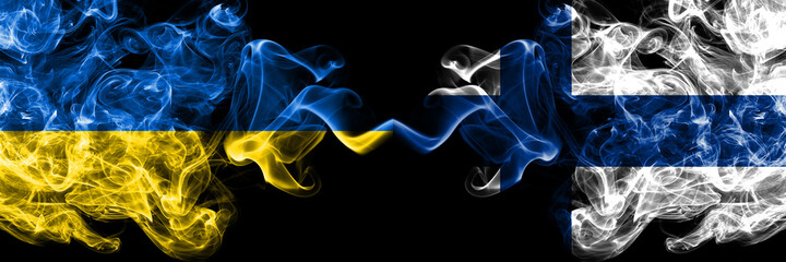 Ukraine, Ukrainian vs Finland, Finnish smoky mystic flags placed side by side. Thick colored silky abstract smokes flags.