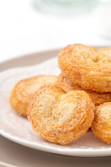 Delicious Palmier butterfly pastry in heart shape for Mother's day dessert.