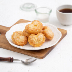 Delicious Palmier butterfly pastry in heart shape for Mother's day dessert.