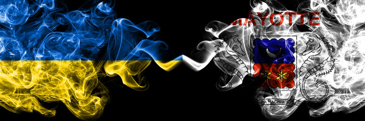 Ukraine, Ukrainian vs France, French, Mayotte smoky mystic flags placed side by side. Thick colored silky abstract smokes flags.