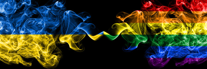 Ukraine, Ukrainian vs Gay, Pride smoky mystic flags placed side by side. Thick colored silky abstract smokes flags.