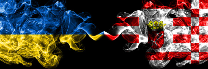 Ukraine, Ukrainian vs Germany, German, Bremen smoky mystic flags placed side by side. Thick colored silky abstract smokes flags.