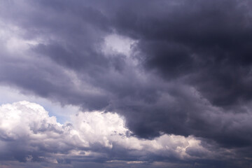 Naklejka na ściany i meble Epic Dramatic storm sky with dark grey black and white cumulus rainy clouds background texture, thunderstorm