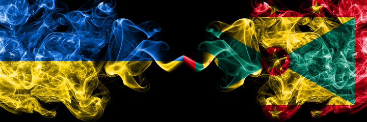 Ukraine, Ukrainian vs Grenada smoky mystic flags placed side by side. Thick colored silky abstract smokes flags.
