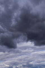 Epic Dramatic storm sky with dark grey black and white cumulus rainy clouds background texture, thunderstorm