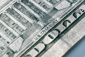 United States treasury sign on the US dollar bill. Macro photo of sign on the dollar banknote.