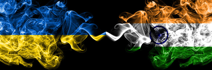Ukraine, Ukrainian vs India smoky mystic flags placed side by side. Thick colored silky abstract smokes flags.