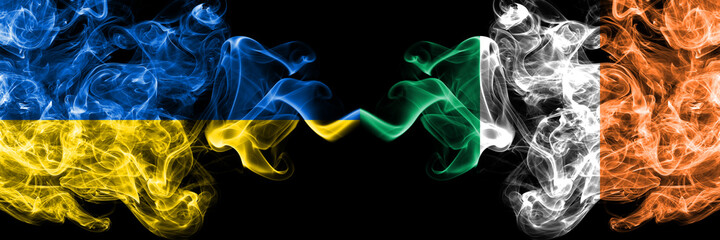 Ukraine, Ukrainian vs Ireland, Irish smoky mystic flags placed side by side. Thick colored silky abstract smokes flags.