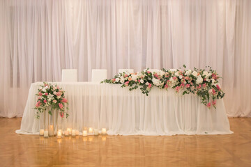 Main table at a wedding reception with beautiful fresh flowers