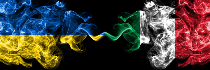 Ukraine, Ukrainian vs Italy, Italian smoky mystic flags placed side by side. Thick colored silky abstract smokes flags.