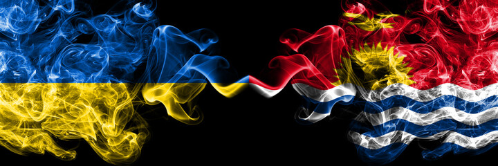 Ukraine, Ukrainian vs Kiribati smoky mystic flags placed side by side. Thick colored silky abstract smokes flags.