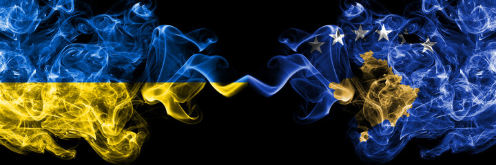 Ukraine, Ukrainian vs Kosovo, Kosovar smoky mystic flags placed side by side. Thick colored silky abstract smokes flags.