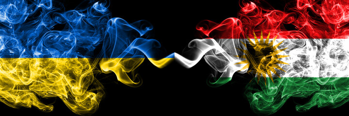 Ukraine, Ukrainian vs Kurdistan, Kurdish, Kurds smoky mystic flags placed side by side. Thick colored silky abstract smokes flags.