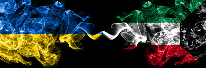 Ukraine, Ukrainian vs Kuwait, Kuwaiti smoky mystic flags placed side by side. Thick colored silky abstract smokes flags.