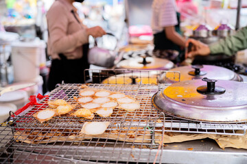 Kanom Krok is a very popular Thai dessert that can be found everywhere in Thailand. - obrazy, fototapety, plakaty