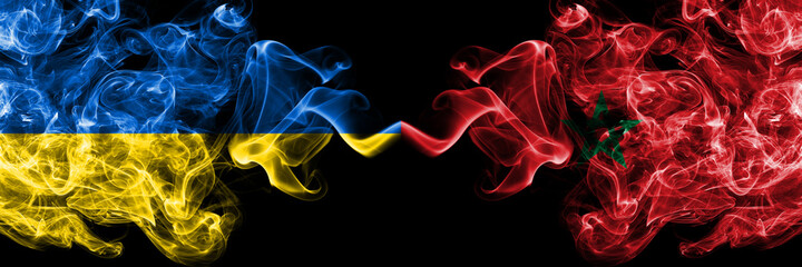 Ukraine, Ukrainian vs Morocco, Moroccan smoky mystic flags placed side by side. Thick colored silky abstract smokes flags.