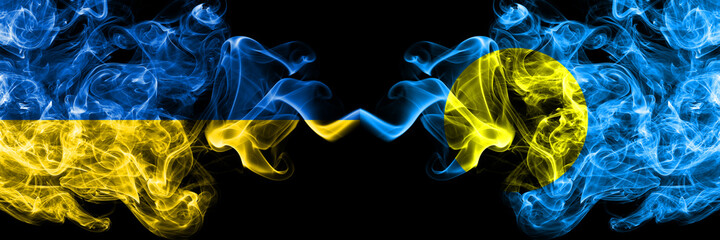 Ukraine, Ukrainian vs Palau smoky mystic flags placed side by side. Thick colored silky abstract smokes flags.