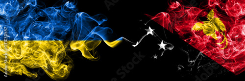 Ukraine, Ukrainian vs Papua New Guinea smoky mystic flags placed side by side. Thick colored silky abstract smokes flags.