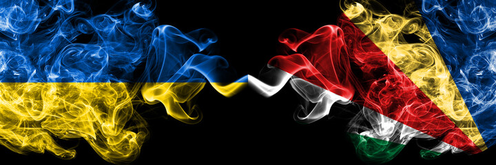 Ukraine, Ukrainian vs Seychelles, Seychellois smoky mystic flags placed side by side. Thick colored silky abstract smokes flags.