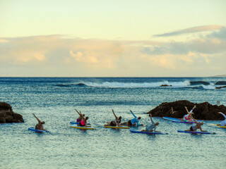 yoga on surfboard
