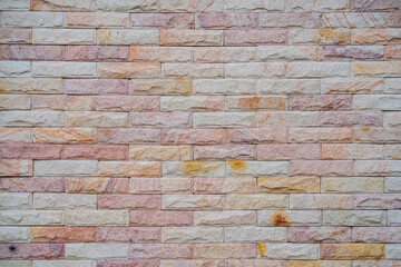 Wide beige brick wall background texture. Home and office design backdrop.