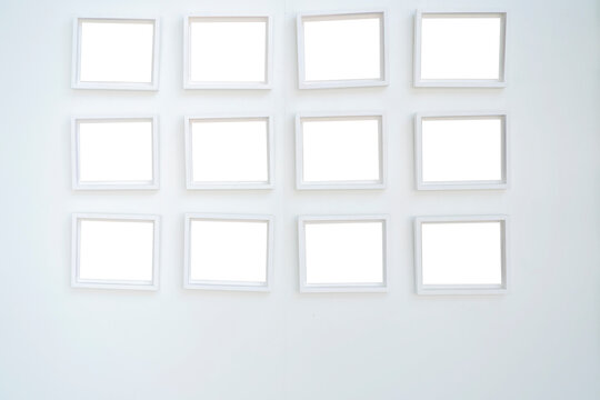 White wooden photo frames mockup, eight set collection on white bricks wall