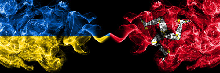 Ukraine, Ukrainian vs United Kingdom, Great Britain, British, Isle of Mann  smoky mystic flags placed side by side. Thick colored silky abstract smokes flags.