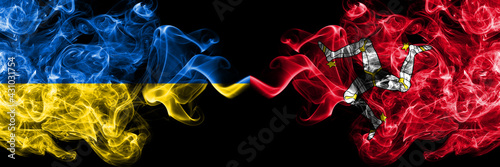 Ukraine, Ukrainian vs United Kingdom, Great Britain, British, Isle of Mann  smoky mystic flags placed side by side. Thick colored silky abstract smokes flags.