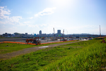 Cranes at the under construction daytime wide shot