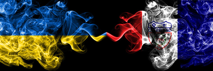 Ukraine, Ukrainian vs United States of America, America, US, USA, American, Cleveland, Ohio smoky mystic flags placed side by side. Thick colored silky abstract smokes flags.