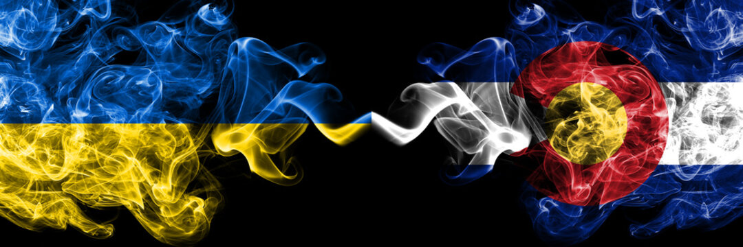Ukraine, Ukrainian vs United States of America, America, US, USA, American, Colorado smoky mystic flags placed side by side. Thick colored silky abstract smokes flags.
